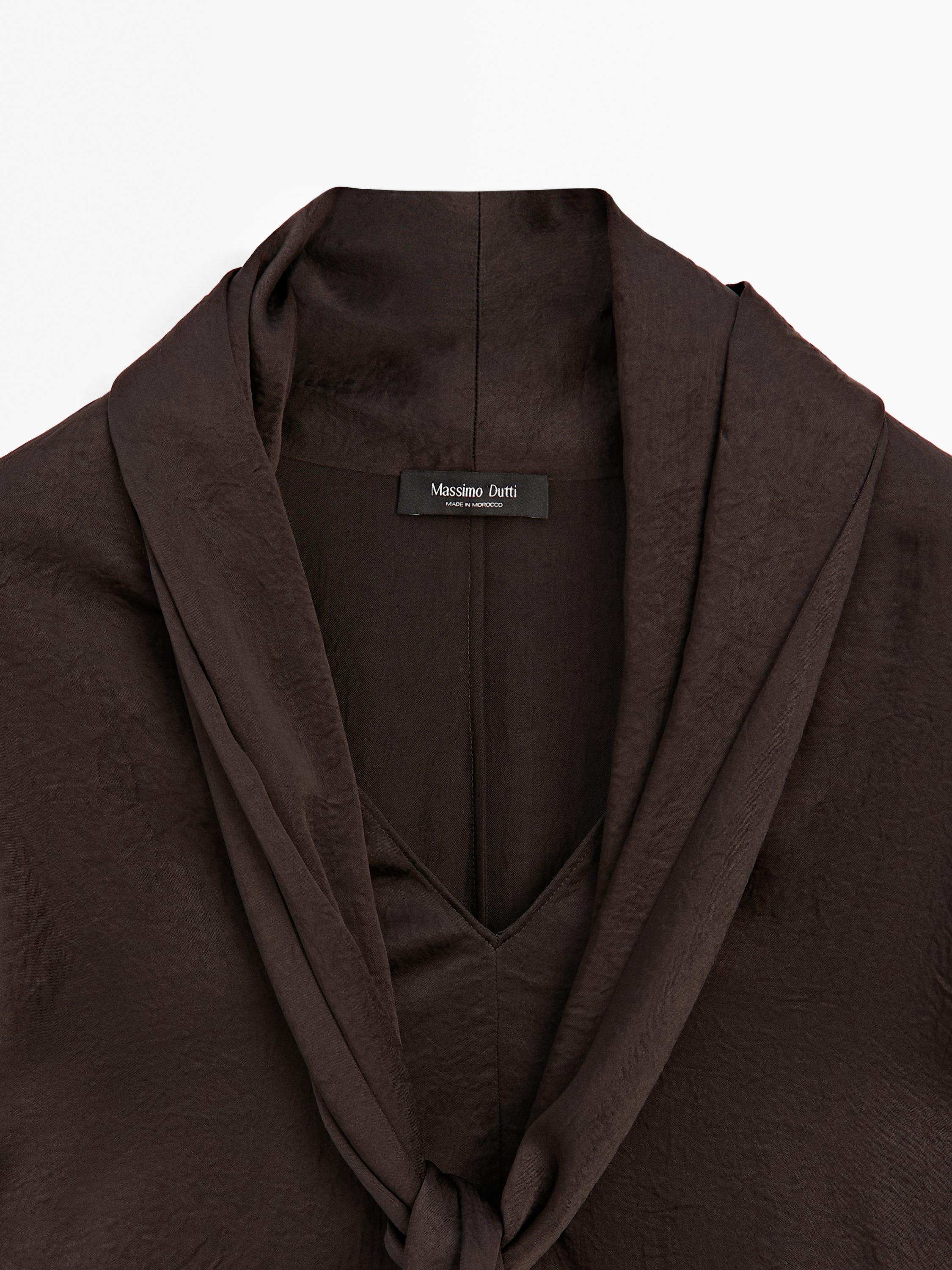 Long flowing blouse with tied neck